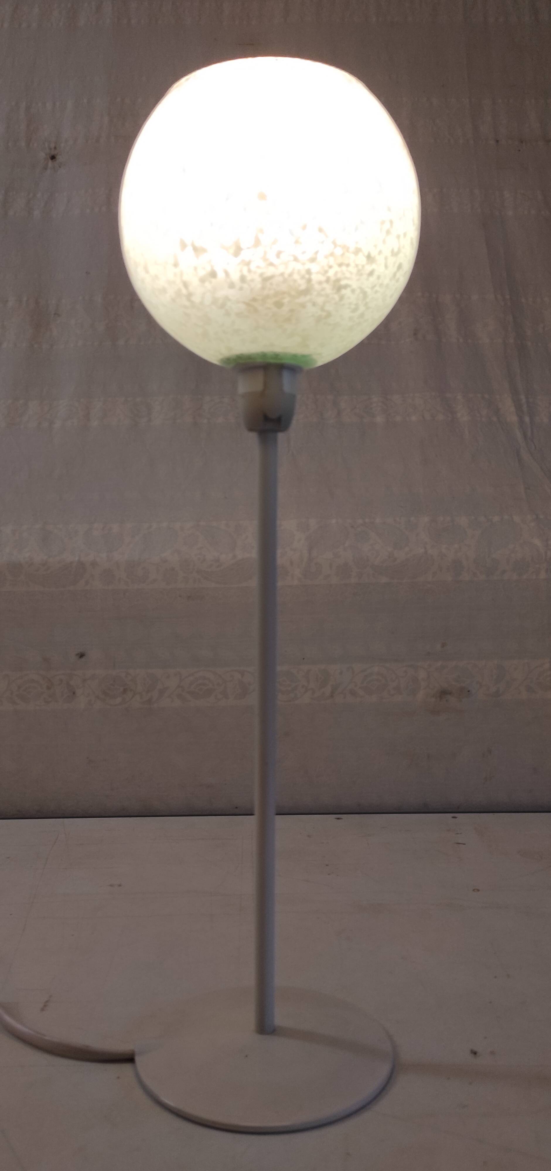 Table lamp with a pale green Clichy glass globe.