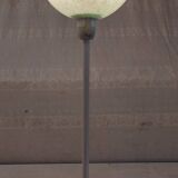 Table lamp with a pale green Clichy glass globe.