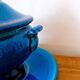 Blue ceramic soup tureen and crackled finish trivet.