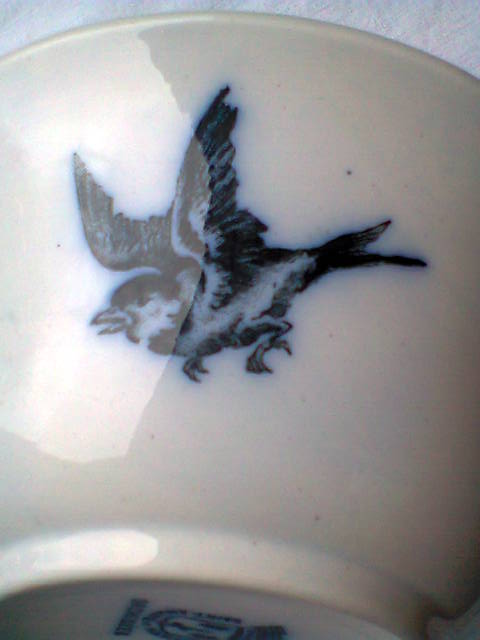 Ramekin in earthenware with decoration of flowers, butterflies and birds