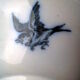 Ramekin in earthenware with decoration of flowers, butterflies and birds