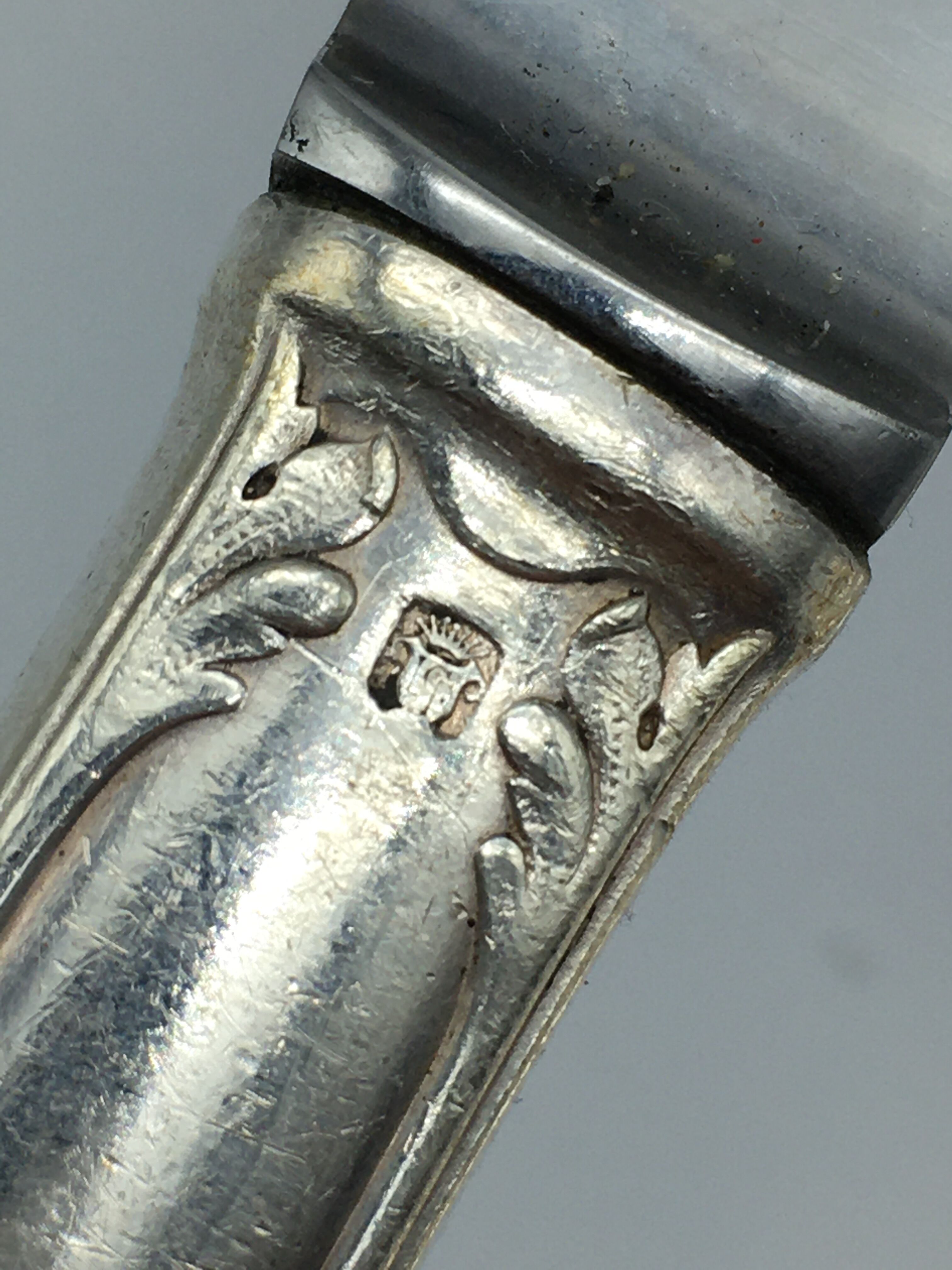 12 silver metal knives.