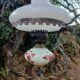 Antique wrought iron, glass and earthenware chandelier