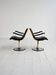 Pair of European 1970s swivel armchairs in faux leather and steel