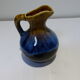 Small vintage ceramic pitcher Blue and brown black reflections