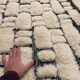 Large cream and black checked Berber rug, 280 × 200 cm.