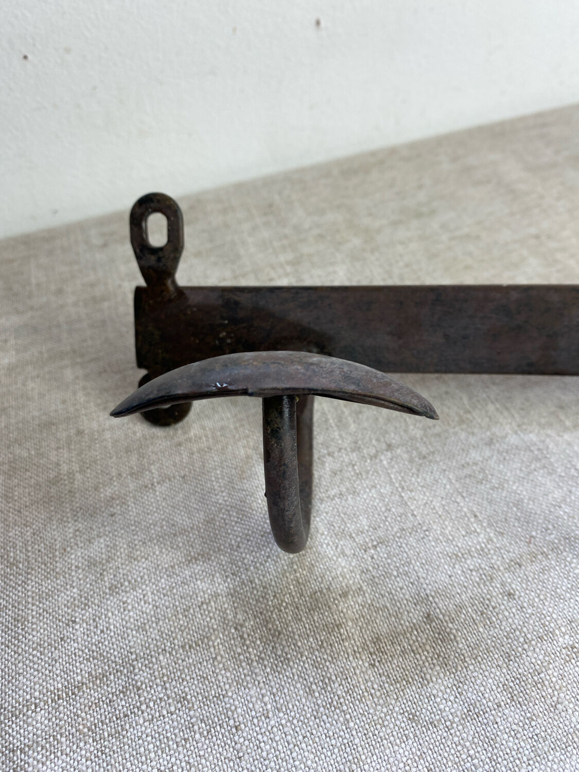 Coat rack, four hooks, in wrought iron.