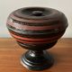 Round covered standing box in lacquered wood, Japanese work of the 1930s.