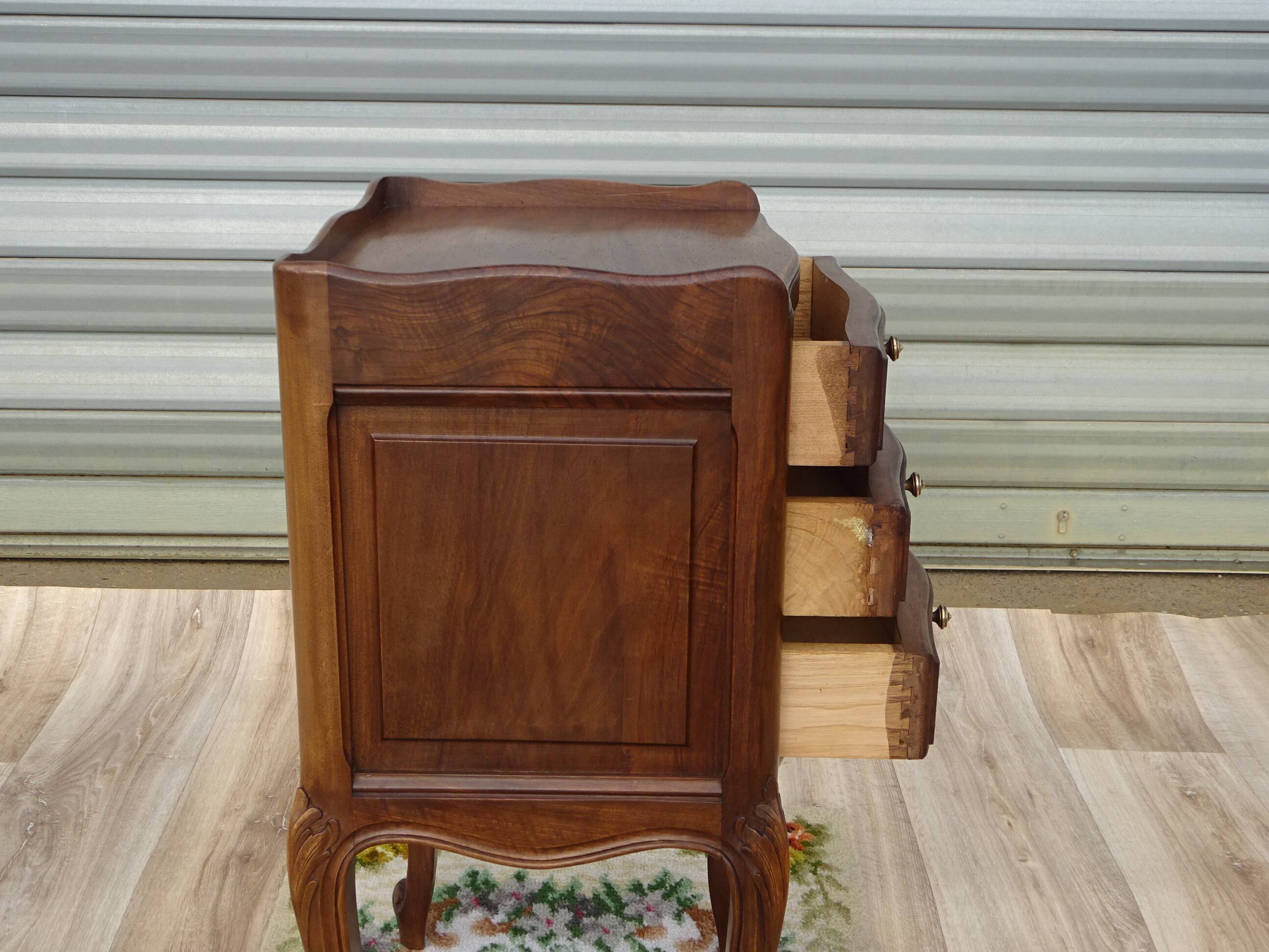 Louis XV bedside table in walnut, 3 drawers, raised edges on the tops.