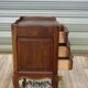 Louis XV bedside table in walnut, 3 drawers, raised edges on the tops.
