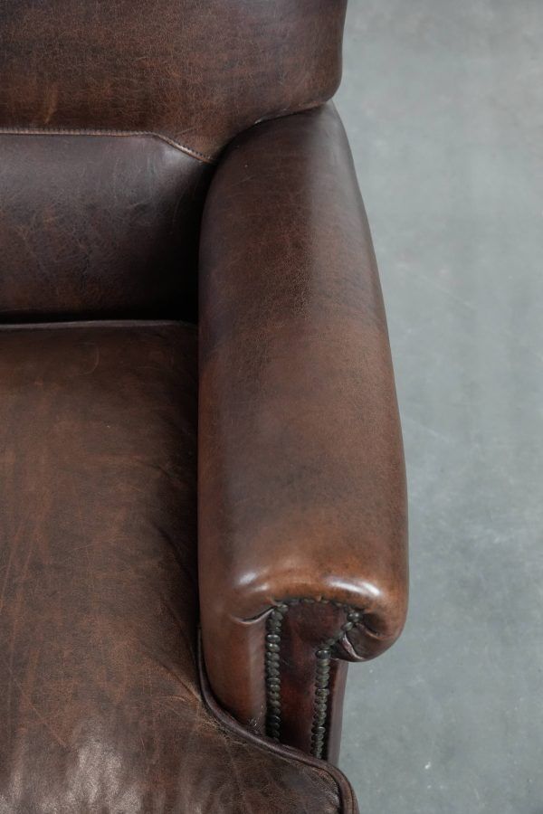 Characterful sheep leather armchair with a beautiful deep colour