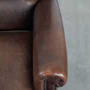 Characterful sheep leather armchair with a beautiful deep colour