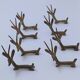 eight vintage brass Gazelle knife rests