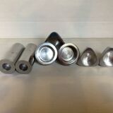 Seven different metal candle holders