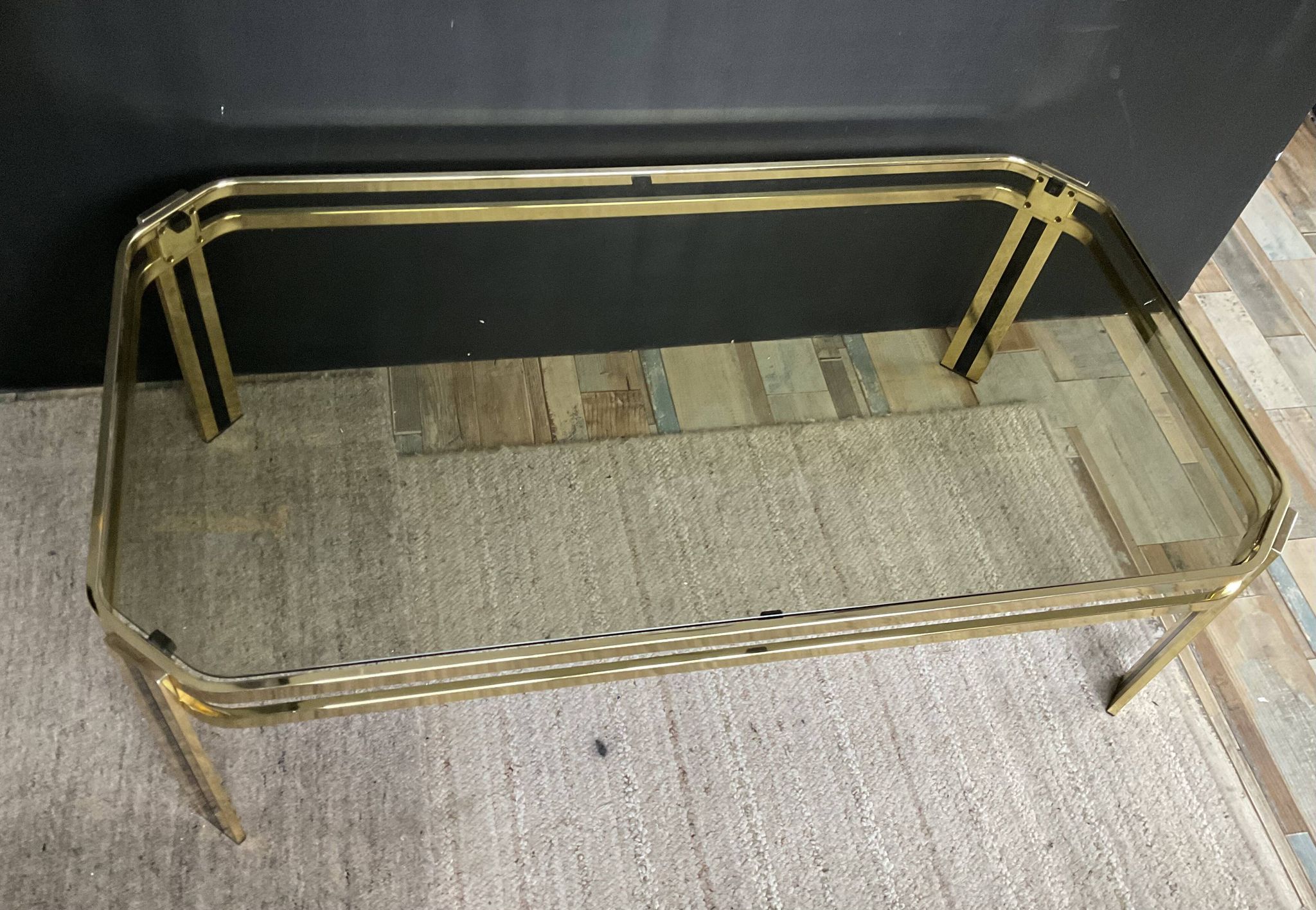 Vintage 1970s coffee table in gold metal and smoked glass.