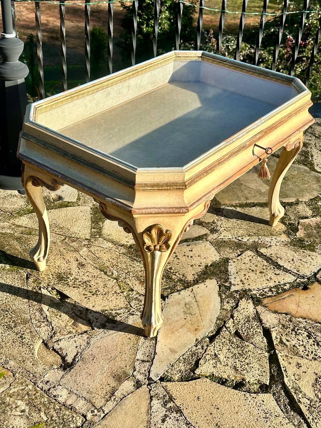 Coffee table/display cabinet in painted polychrome wood.