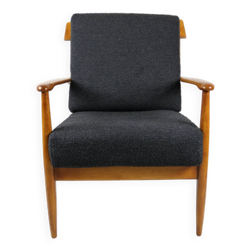 Black boucle chair, Danish design on the cushions, 1970s.