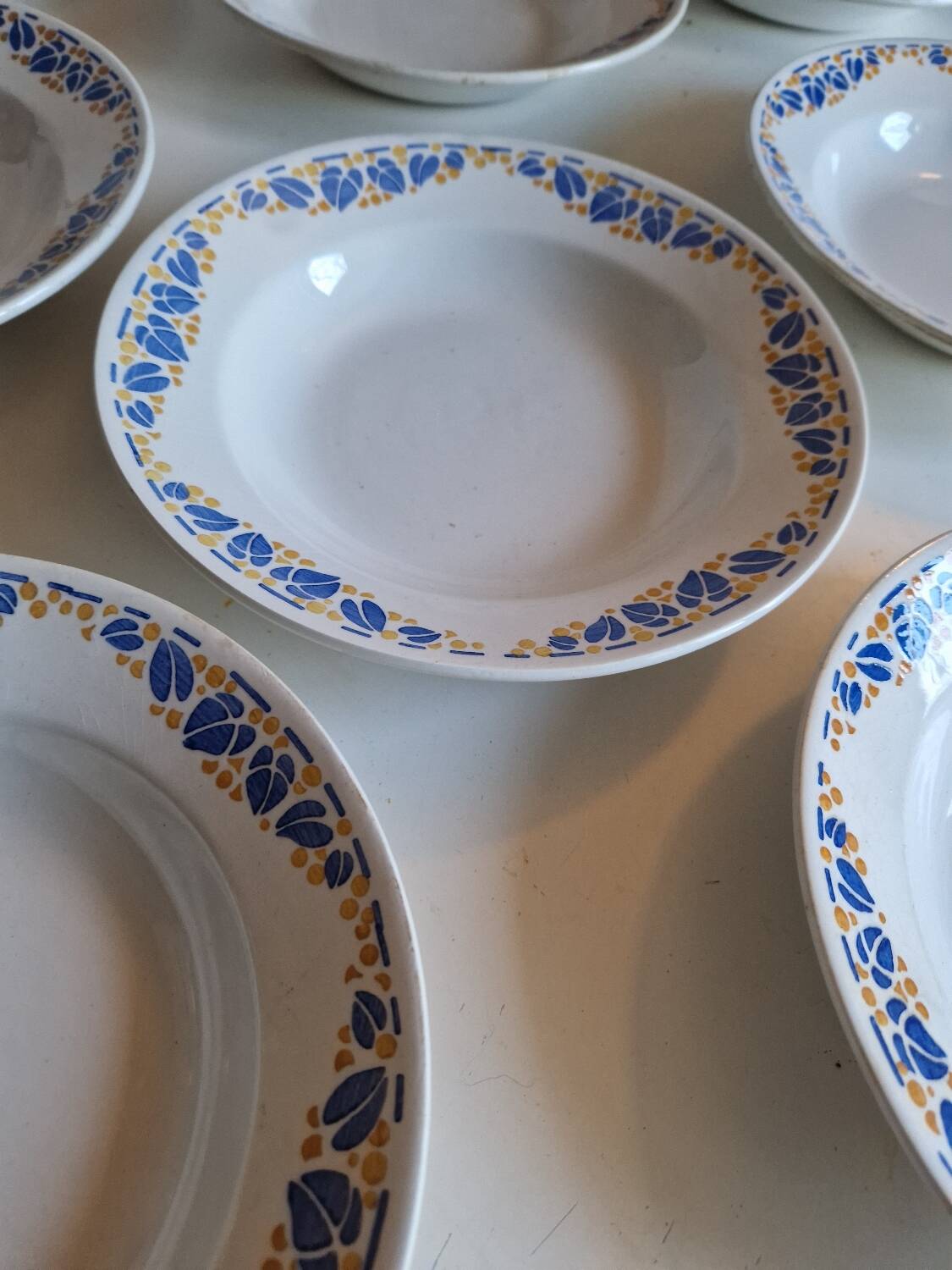Set of 9 deep plates, earthenware from Creil Montereau, Colette model.