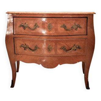Louis XV style commode with two drawers and a pink marble top.