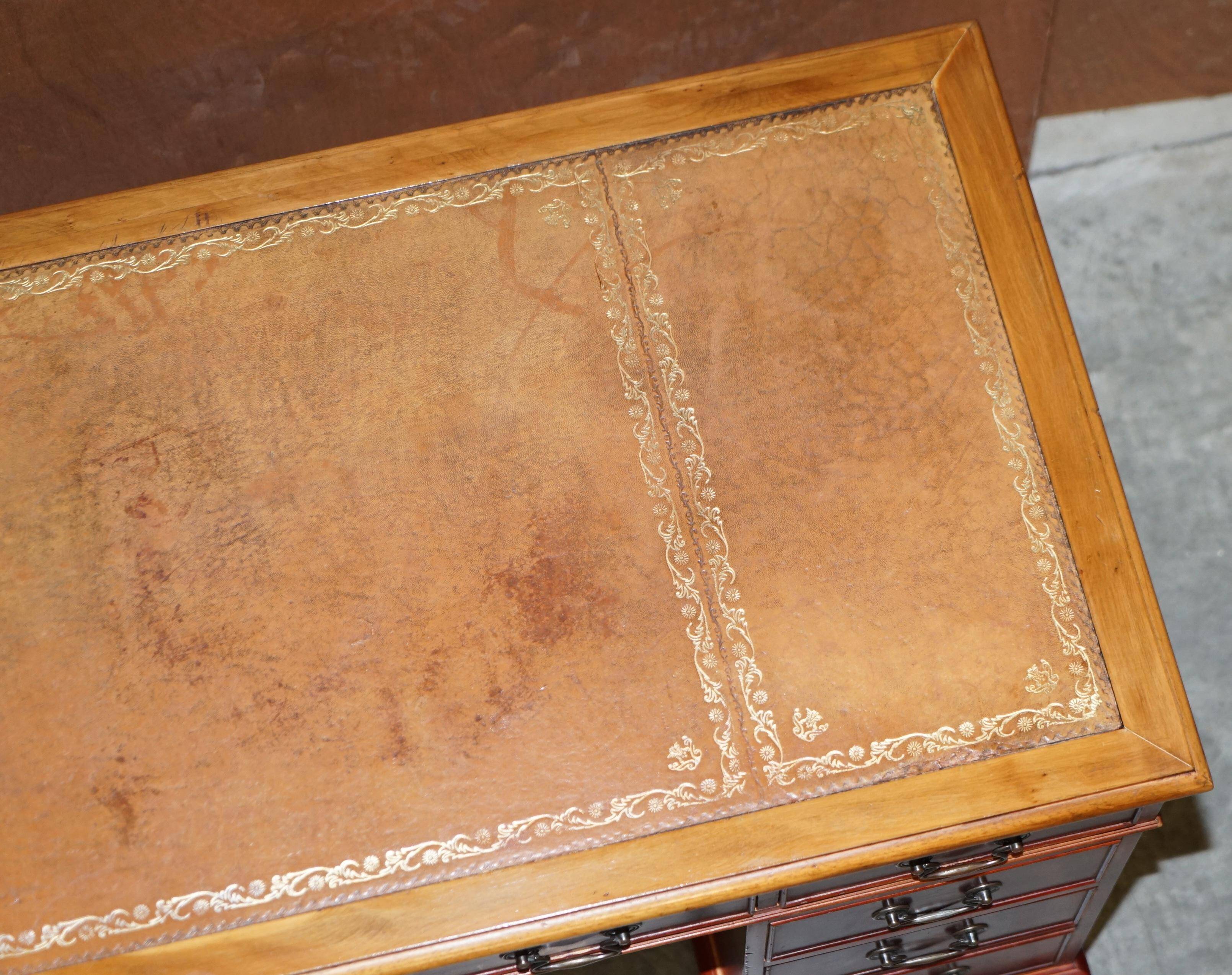 Vintage walnut desk with a leather top and two drawers.