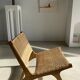 Reclining armchair in natural wood and woven rattan