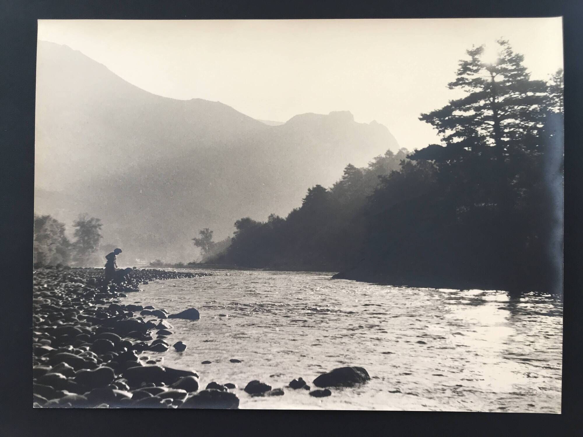River landscape with characters, 60s/70s. Black and white silver print.