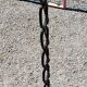 Vintage floor lamp from the 50s in blackened iron in the shape of a chain