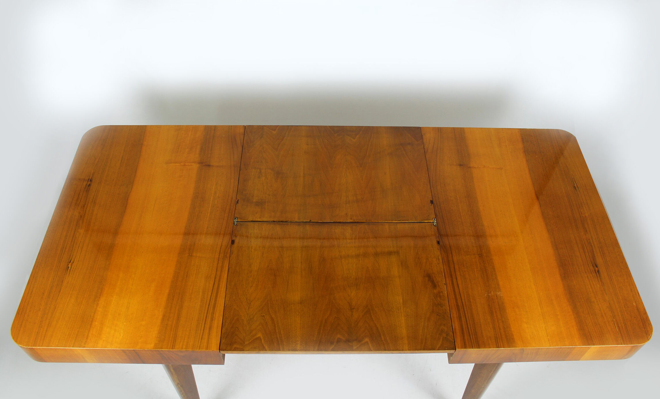 Walnut folding dining table by Jindrich Halabala for UP Zavody, 1940s
