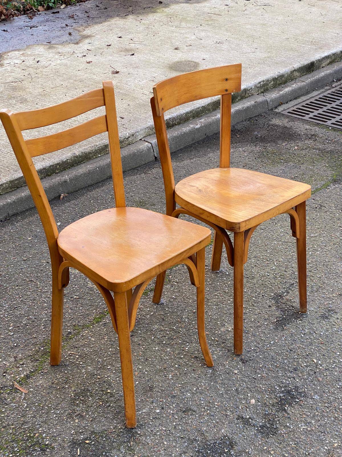 2 Scandinavian bistro chairs by Baumann in light wood from 1980.