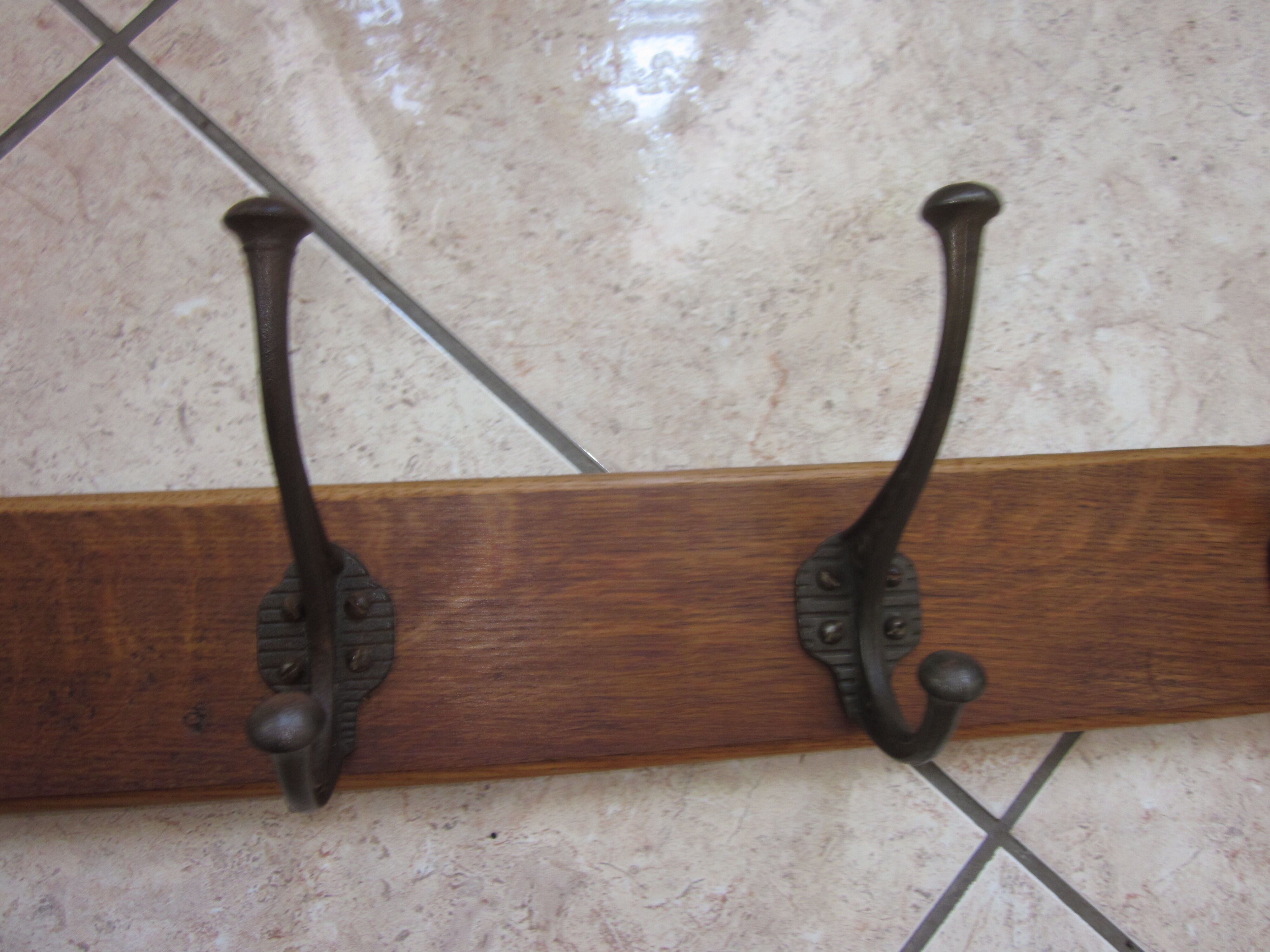 Bistro coat rack has 6 cast iron pads