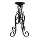 Wrought iron candlestick on four-legged base circa 1900-1930