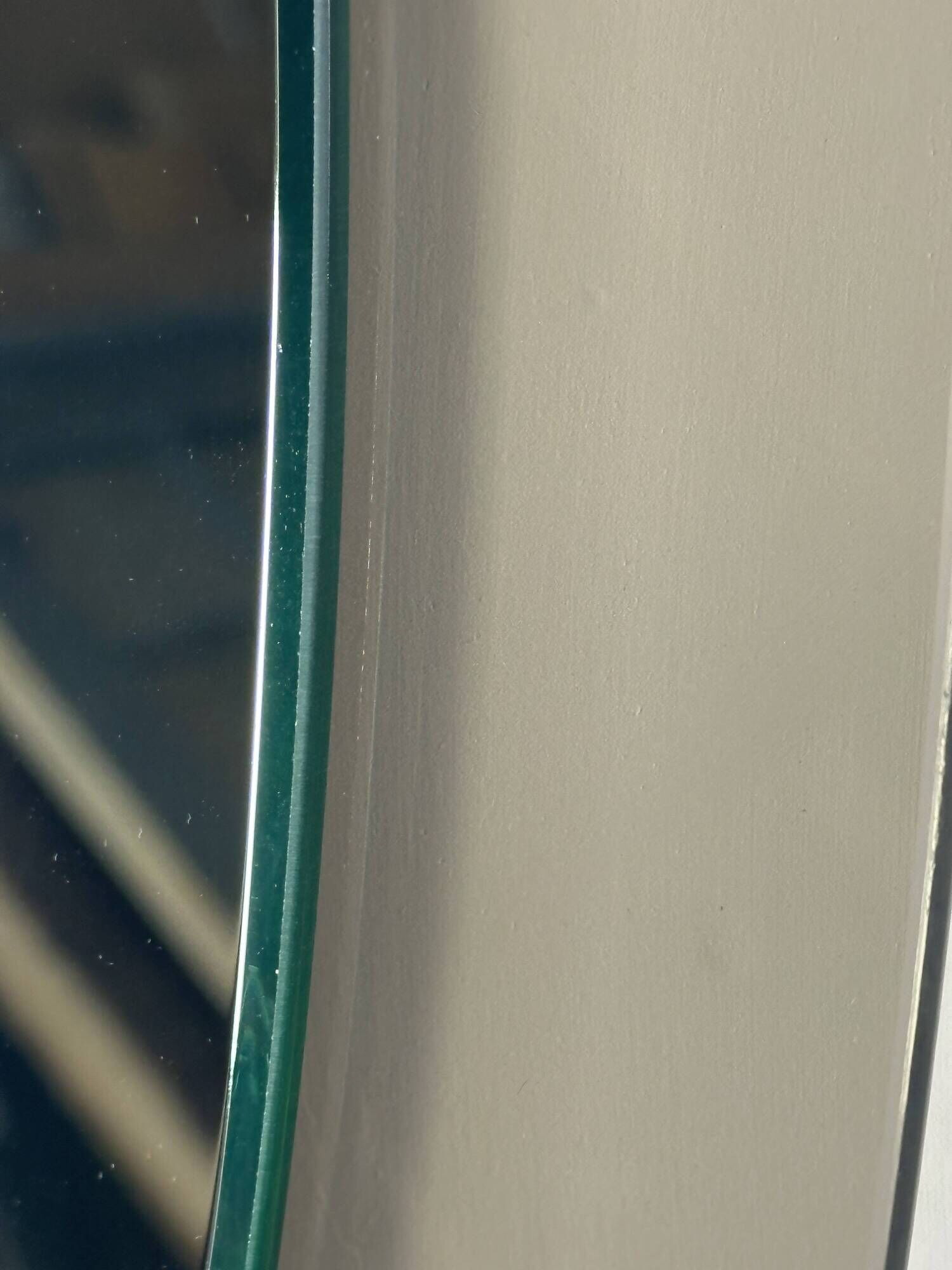 Vintage mirror with smoked glass frame from the 1970s.
