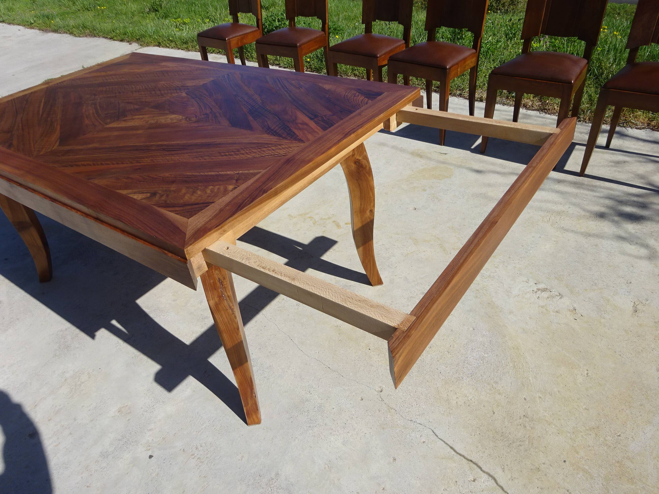Antique solid walnut table with marquetry and extensions.