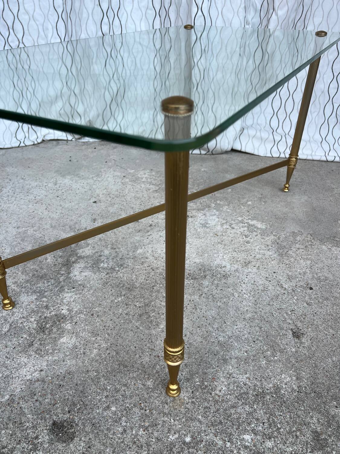 Vintage gold coffee table. Glass top.
