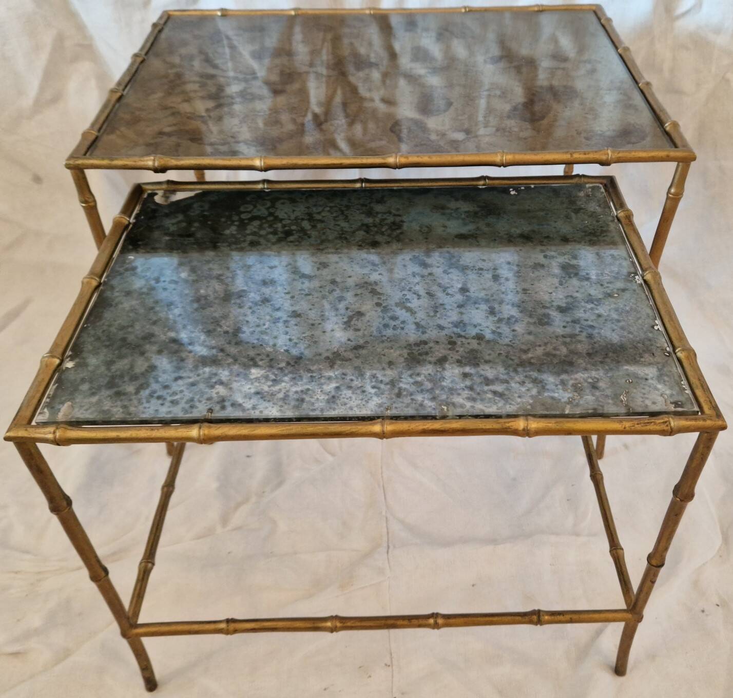 Pair of vintage nesting tables in faux bamboo with a gold finish – distressed mirrors