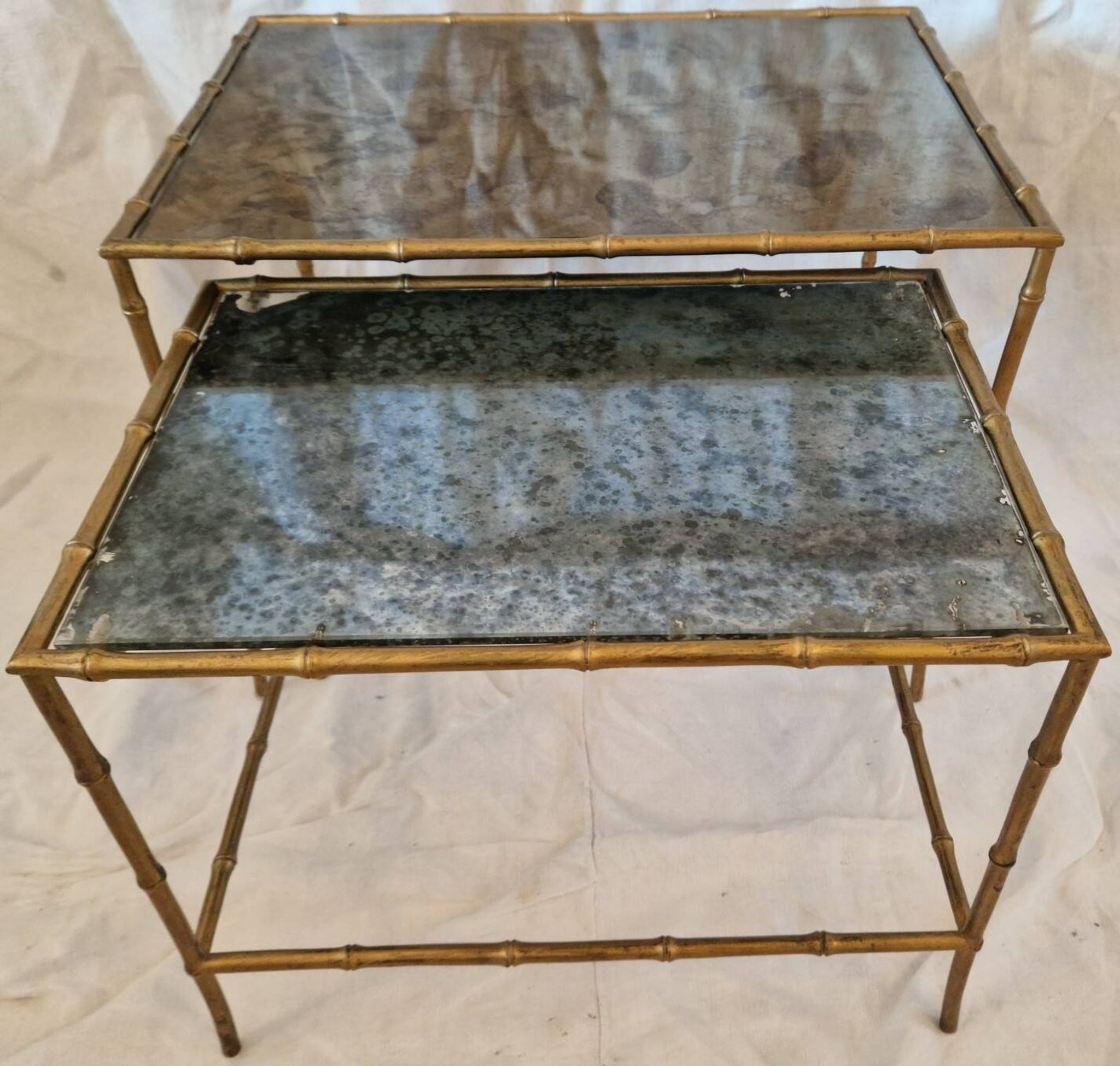Pair of vintage nesting tables in faux bamboo with a gold finish – distressed mirrors