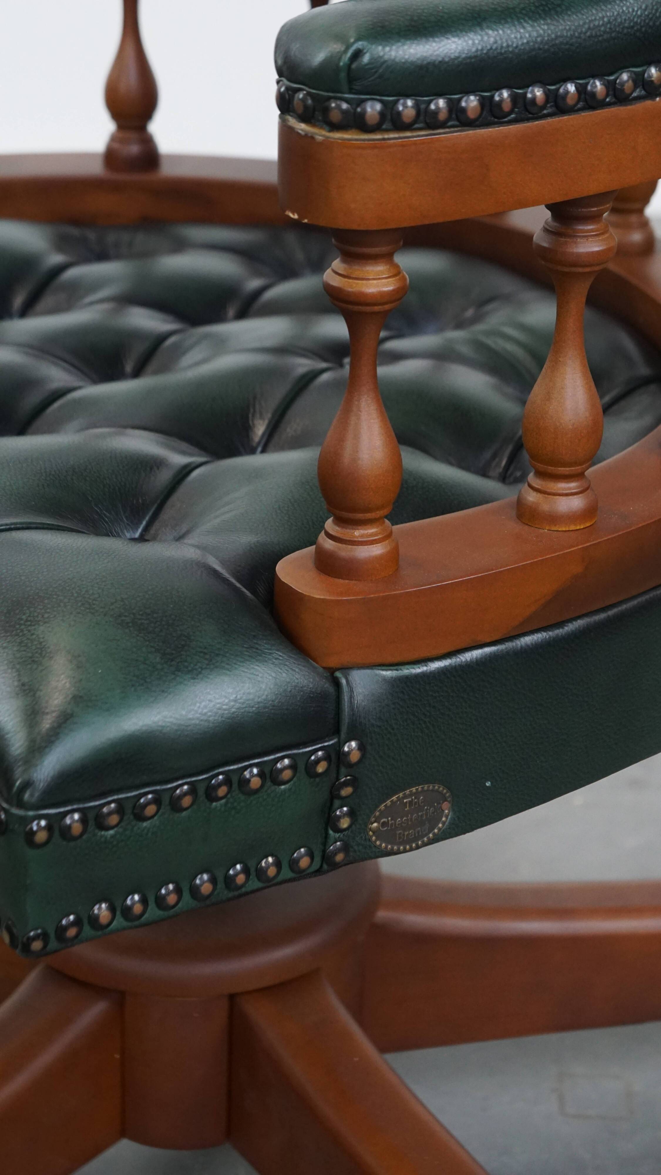 Dark green chesterfield office chair in cowhide leather on wheels