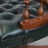 Dark green chesterfield office chair in cowhide leather on wheels