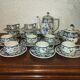 Henriot Quimper earthenware coffee set with floral decoration and elegant blue