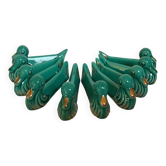 Ten green and gold duck knife holders