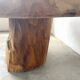 Organic brutalist coffee table in solid cedar, trunk pedestal, 1970s.