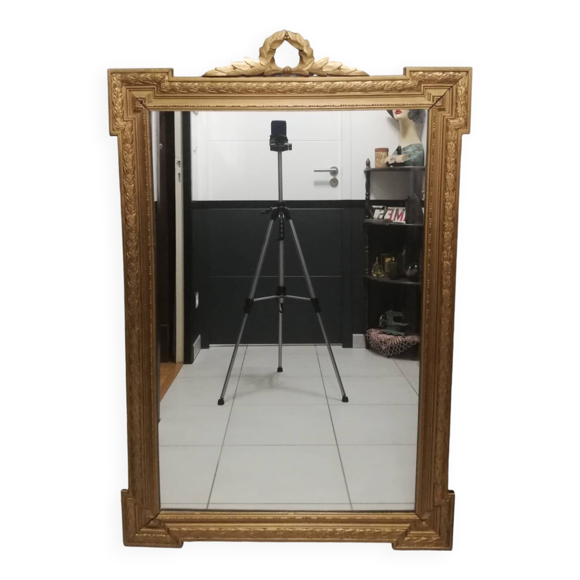 Carved wooden pediment mirror