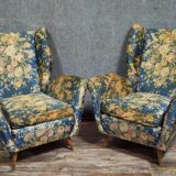 Pair of vintage armchairs with enveloping backrest.