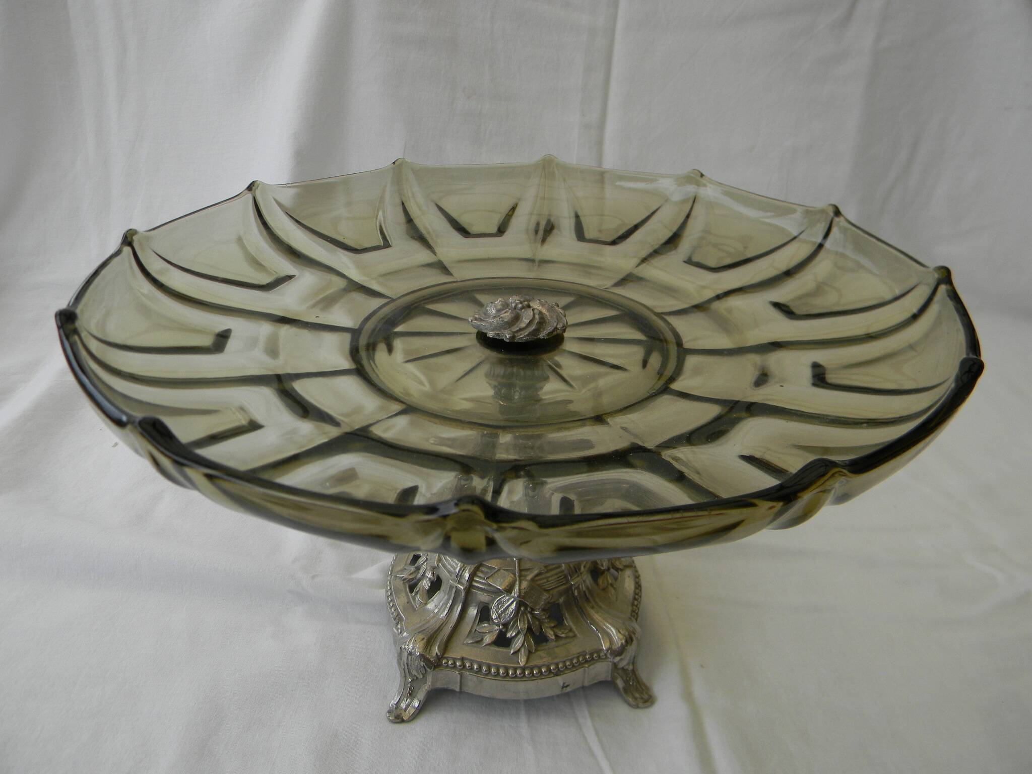 Large smoked glass fruit bowl with a metal base.