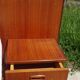 Vintage bed in teak with integrated bedside table.