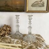 Pair of moulded glass candlesticks, ram heads and masks