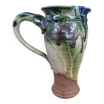 Enameled stoneware pitcher signed