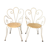 Pair of wrought iron garden armchairs