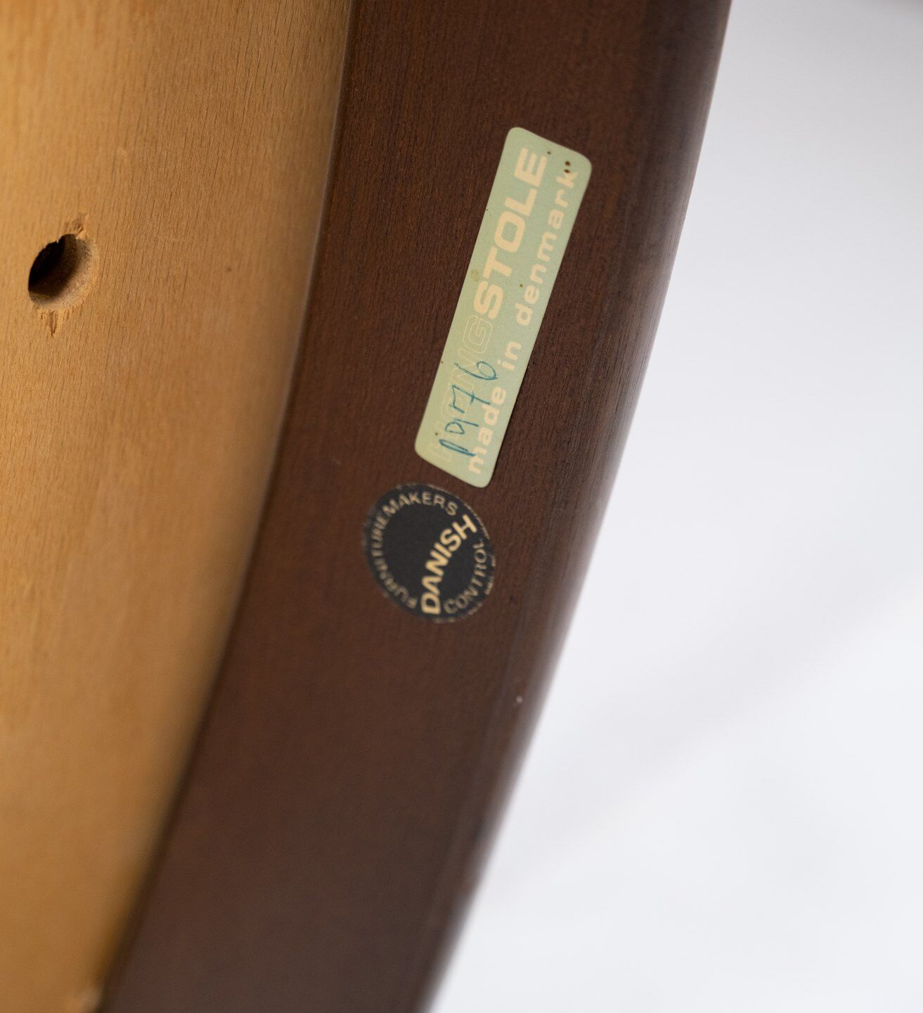 Armchair in rosewood and black leather of danish design from 1976.