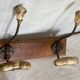 19th-century wall coat rack with 2 metal and horn hooks.